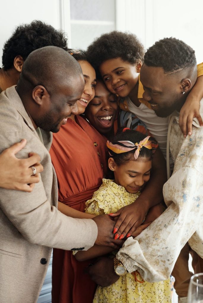 Black family hugging each other